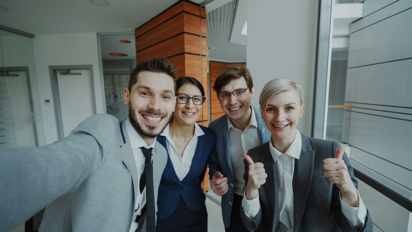 Office colleagues taking a team photo